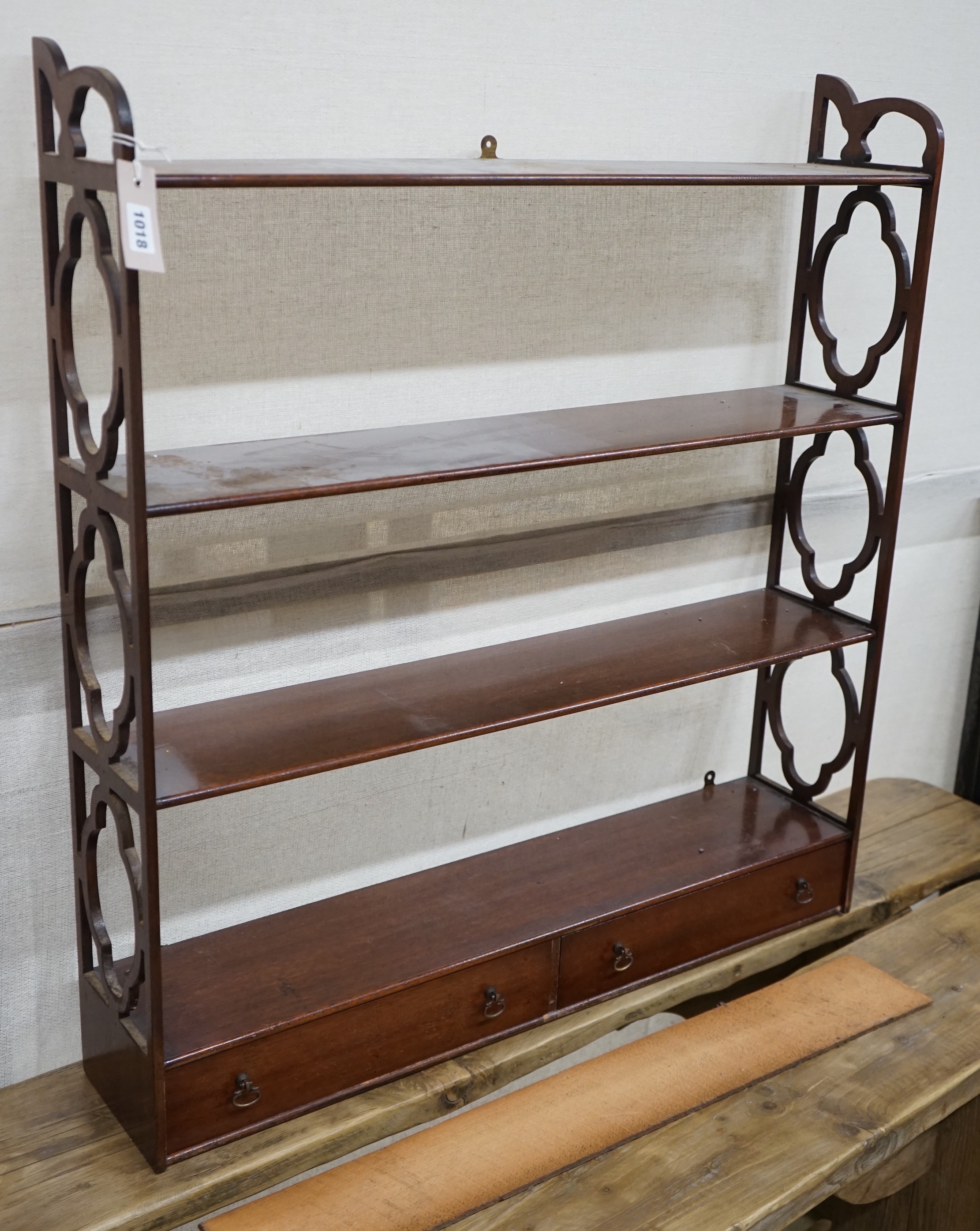 A reproduction George III style mahogany four tier wall bracket, width 81cm, depth 17cm, height 88cm